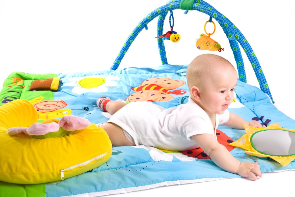 Toddler on playmat