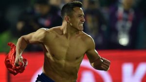 Chile's forward Alexis Sanchez celebrates after scoring agaiinst Argentina to win the 2015 Copa America football championship, in Santiago, Chile, on July 4, 2015. Chile defeated Argentina 4-1 in the penalty shootout. AFP PHOTO / RODRIGO ARANGUA (Photo credit should read RODRIGO ARANGUA/AFP/Getty Images)