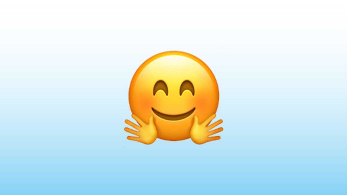 Qu significa el emoji de la cara con manos abrazando en WhatsApp